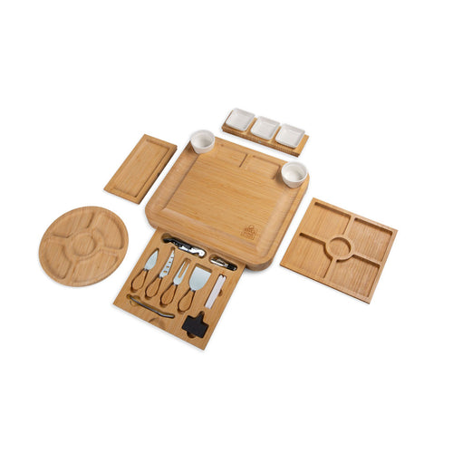 Giant Charcuterie set made of bamboo with utensils and coasters on a white background.
